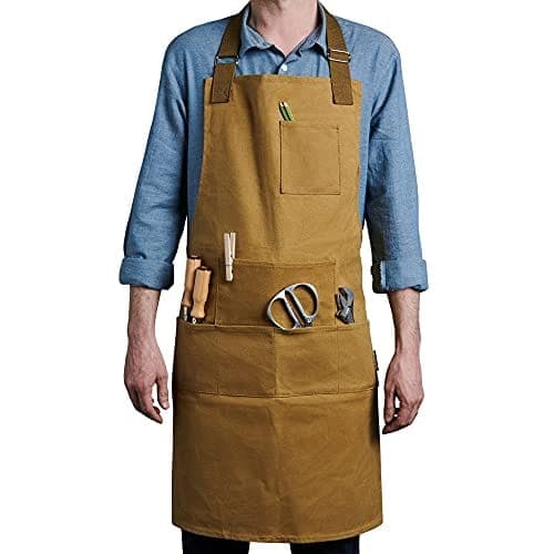 Tablier en toile cirée avec six poches sur le devant, sangles de cou et de taille