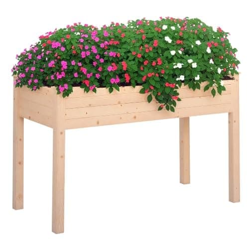 Carré potager en bois de sapin naturel monté sur quatre pieds, avec un treillis